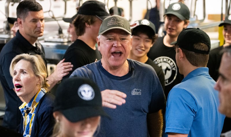 Minnesota Gov. Tim Walz thanks supporters after serving ice cream in the Dairy Barn at the Minnesota State Fair.