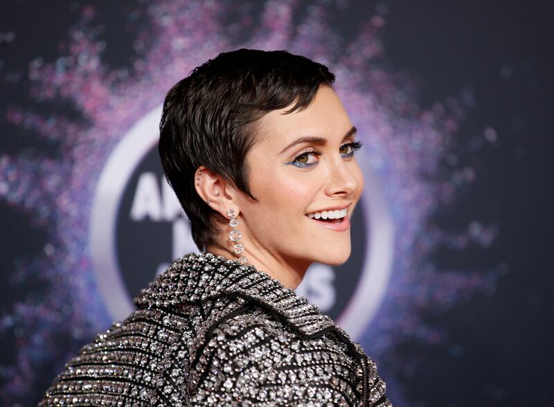 Alyson Stoner smiles on the red carpet at the 2019 American Music Awards.