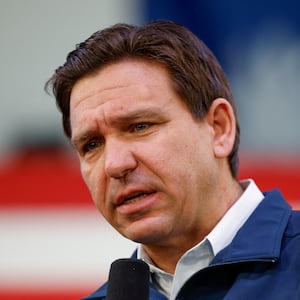 Florida Gov. Ron DeSantis speaks on stage at an event.