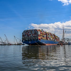 Crane barges surround the container ship Dali and the wreckage of the Francis Scott Key Bridge two weeks after the catastrophic collapse