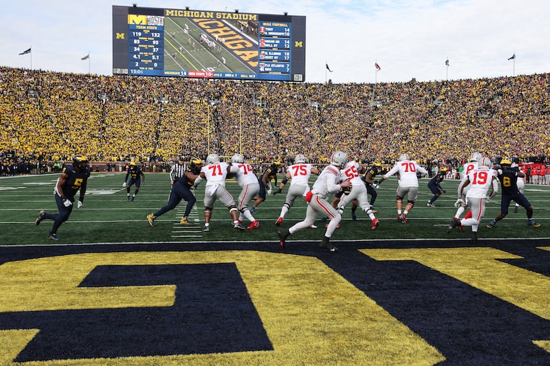 Ohio State Buckeyes quarterback Kyle McCord (6) rolls out as he looks for a receiver during a regular season Big Ten Conference college football game between the Ohio State Buckeyes and the Michigan Wolverines.