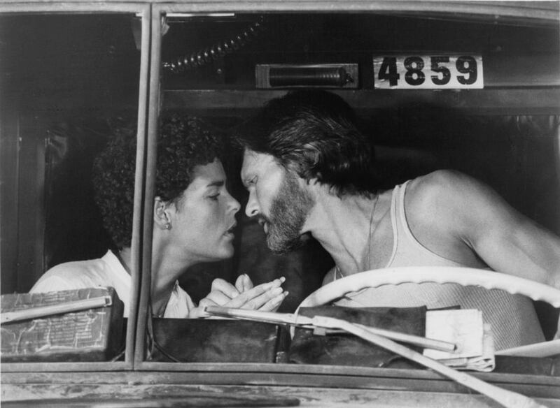 Ali Macgraw is about to kiss Kris Kristofferson in a scene from the 1978 film “Convoy.”