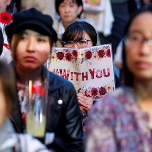 Protesters gather at the rally called 'Flower Demo' to criticize recent acquittals in court cases of alleged rape in Japan and call for revision of the anti-sex crime law, in front of Tokyo Station in Tokyo, Japan June 11, 2019.