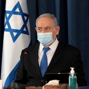 FILE PHOTO: Israeli Prime Minister Netanyahu wears a protective mask, amid the spread of the coronavirus disease (COVID-19), as he holds a weekly cabinet meeting at the Foreign Ministry in Jerusalem, July 5, 2020.