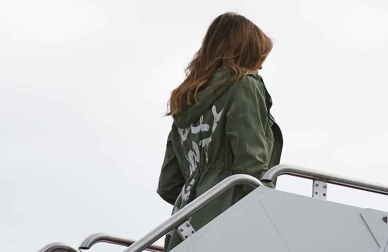 Melania Trump boards a flight at Andrews Air Force Base in Maryland on June 21, 2018 wearing a rain jacket that reads, ‘I Really Don’t Care. Do U?’