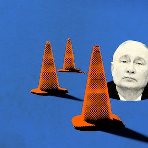 A photo illustration of Vladamir Putin poking out of a hole in the ground with traffic cones surrounding him