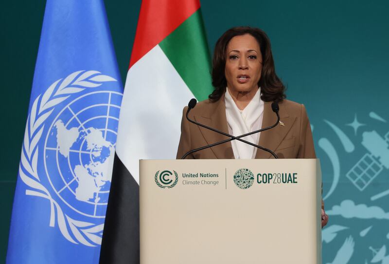 Kamala Harris stands at a lectern and delivers a speech