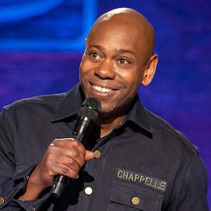 Photograph of Dave Chappelle performing standup in his Netflix special, The Dreamer