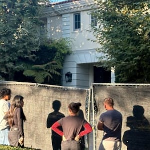 From left: The Menendez brothers pictured outside their family's home in Beverly Hills; tourists visiting the property in September 2024.