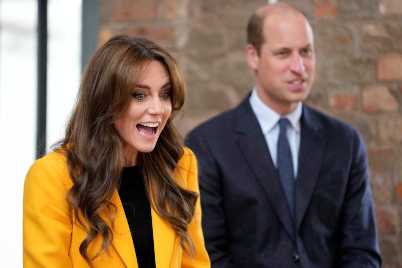 Kate Middleton, left, and Prince William speak to young people as they participate in a forum for young people on World Mental Health Day.