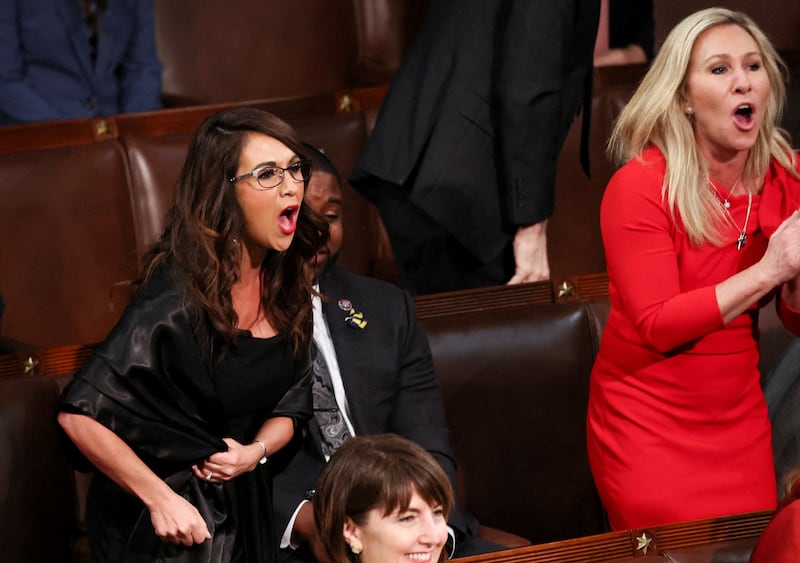 Rep. Lauren Boebert (R-CO) and Rep. Marjorie Taylor Greene (R-GA) scream \"Build the Wall\" at President Joe Biden during Biden's State of the Union address.