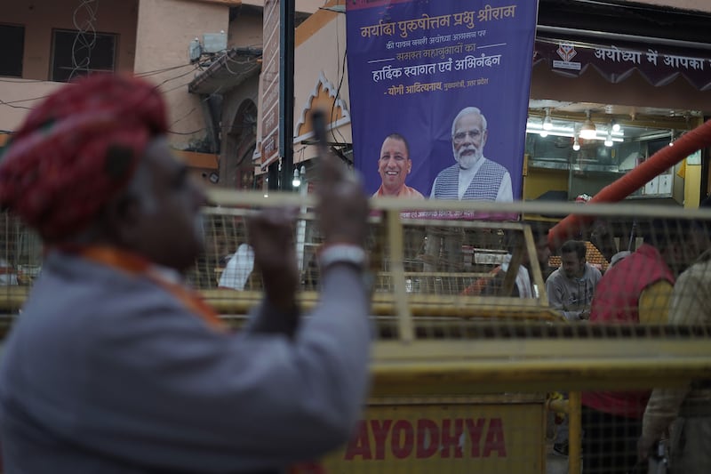 The city of Ayodhya is adorned with hoardings featuring Narendra Modi and the state's chief minister Yogi Adityanath in anticipation of the Ram Mandir inauguration.