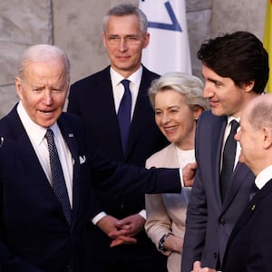 A photo of President Joe Biden meeting with world leaders during the 2022 NATO summit in Belgium.