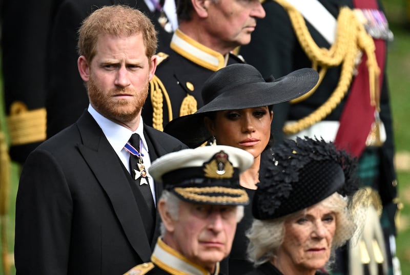 Britain's Meghan, Duchess of Sussex, reacts as she, Prince Harry, Duke of Sussex, Queen Camilla and King Charles attend the state funeral and burial of Britain's Queen Elizabeth, in London, Britain, Sept. 19, 2022.