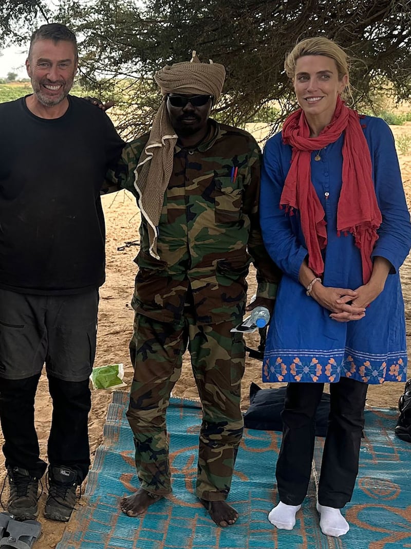 (From left to right): Scott McWhinnie, a CNN camera man, a Sudan militant in the center, and CNN reporter Clarissa Ward pose in a photo.