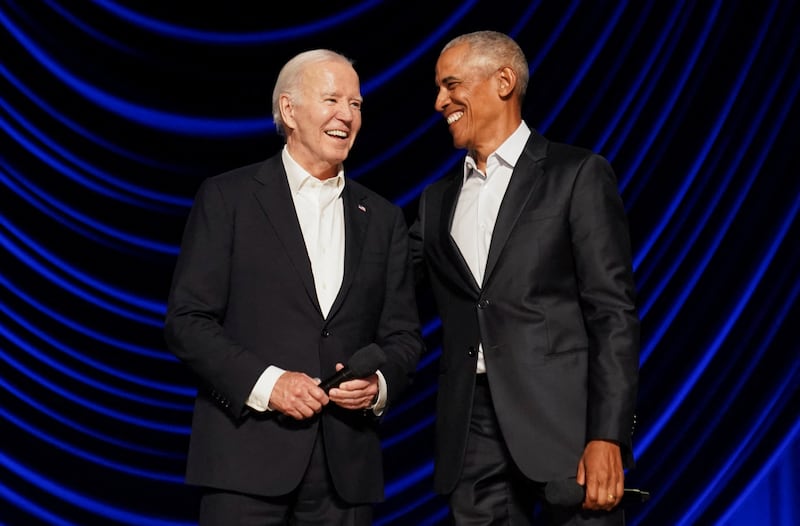 U.S. President Joe Biden and former U.S. President Barack Obama share a laugh during a star-studded campaign fundraiser