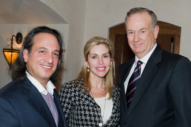 A photo of Jan Burman and his wife Renee with right-wing TV host Bill O'Reilly at a 2010 law enforcement fundraiser on Long Island.