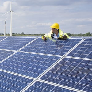 solar panels with a person looking over them and sun shining hypocrisy solarize connecticut david rand gordon kraft todd