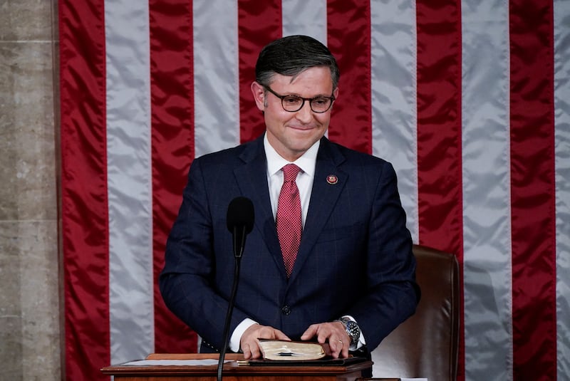 Speaker Mike Johnson (R-LA) smiles as he reacts to the applause of members of the House after being elected to be the new Speaker.