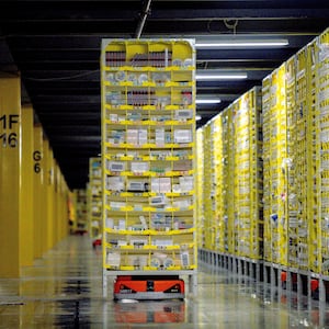 A photo of robots transporting goods at an Amazon warehouse