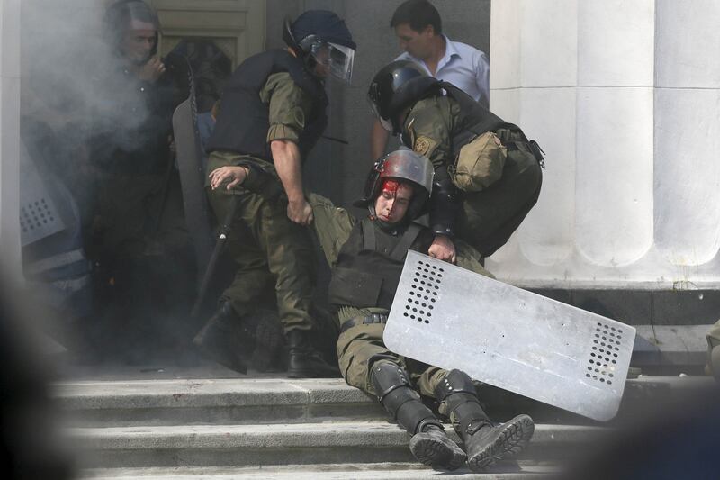 articles/2015/08/31/kiev-grenade-kills-riot-police-as-divided-ukraine-oks-minsk-ceasefire/150831-ukraine-clashes6_iipnd1