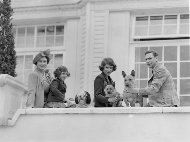 The British royal family is pictured at the Royal Lodge in 1940. From left: Queen Elizabeth, Princess Margaret, Princess Elizabeth and King George VI—and their dogs Ching, Carol and Crackers.