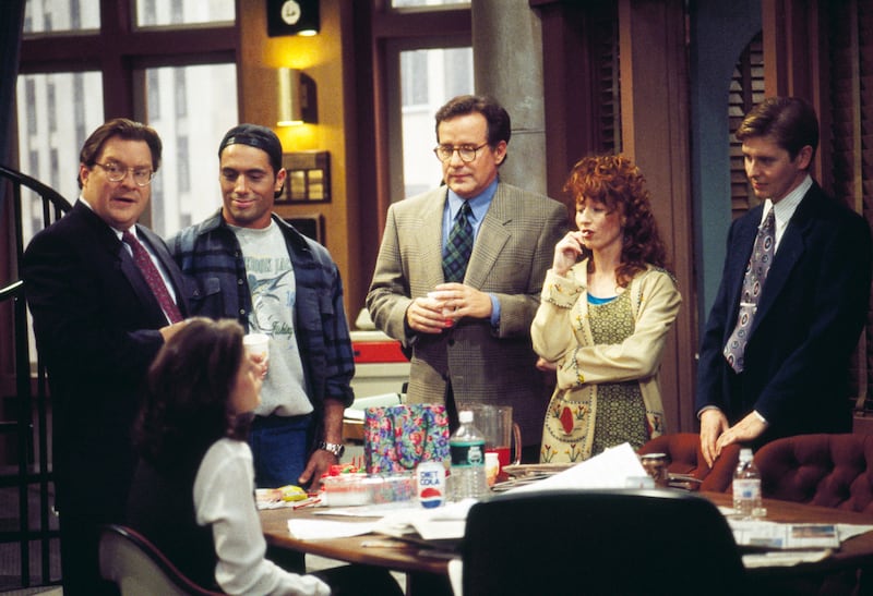 NEWSRADIO -- Pictured: (l-r) Stephen Root as Jimmy James, Maura Tierney as Lisa Miller (seated), Joe Rogan as Joe Garrelli, Phil Hartman as Bill McNeal, Vicki Lewis as Beth, Dave Foley as Dave Nelson  (Photo by J. Delvalle/NBCU Photo Bank/NBCUniversal via Getty Images via Getty Images)