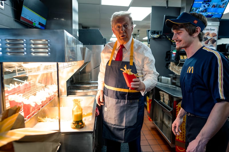 President-elect Donald Trump works behind the counter during a campaign event at McDonald's restaurant on October 20, 2024 in Feasterville-Trevose, Pennsylvania.