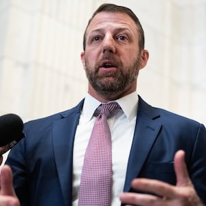 Sen. Markwayne Mullin, R-Okla., talks with reporters after a meeting with Pete Hegseth