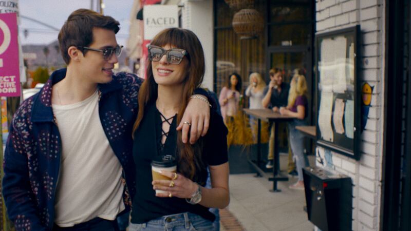 Anne Hathaway as Solène and Nicholas Galitzine as Hayes Campbell in The Idea of You