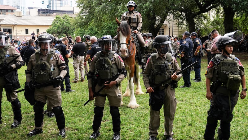 A photo including Texas State Troopers during a pro-Palestinian protest on the campus of the University of Texas in Austin