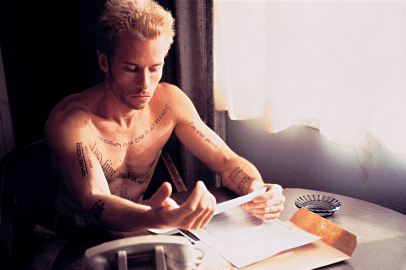 articles/2014/05/23/the-great-character-actor-guy-pearce-on-his-brilliant-career-from-priscilla-to-the-rover/badass-movie-tattoos-memento_qfaq0h