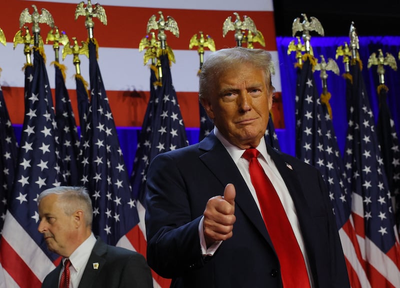 Republican presidential nominee and former U.S. President Donald Trump gestures as he stand on stage at his rally, at the Palm Beach County Convention Center in West Palm Beach, Florida, U.S., November 6, 2024. REUTERS/Brian Snyder