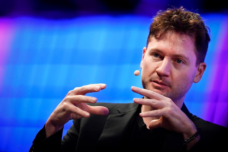 Bryan Johnson gestures during a interview at the main stage of the Web Summit in Lisbon on November 7, 2017.