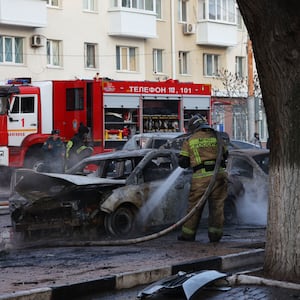 A photograph of officials working on the damage after a Ukrainian attack on Belgorod, Russia on December 30, 2023.