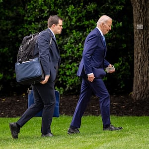 President Joe Biden, accompanied by his personal aide Jacob Spreyer (C) and Assistant to the President & Director of Oval Office Operations Richard Ruffner (L), arrive at the White House. 