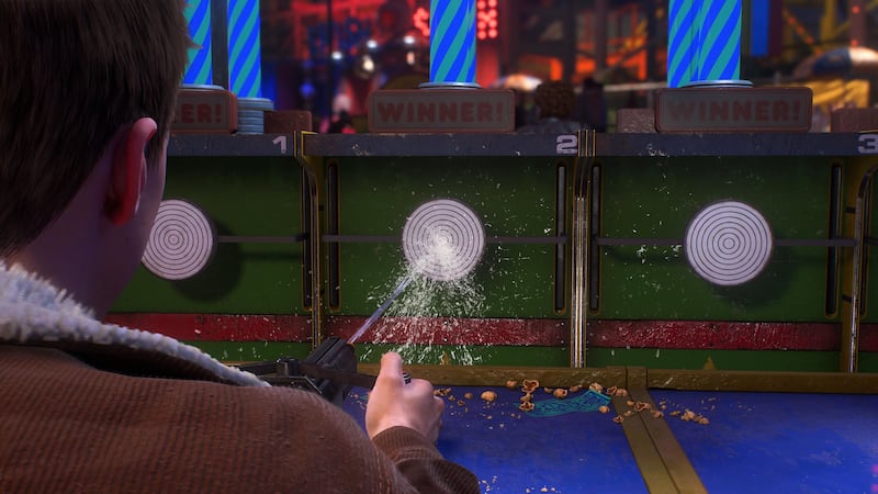 Peter Parker plays water gun game at Marvel Spider-Man 2's Coney Island.