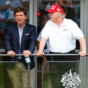 Former President Donald Trump, Tucker Carlson and Marjorie Taylor Greene during the 3rd round of the LIV Golf Invitational Series Bedminster on July 31, 2022.