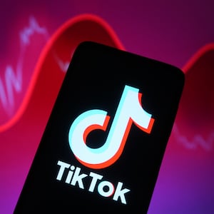 In this photo illustration, a TikTok logo is seen displayed on a smartphone screen.