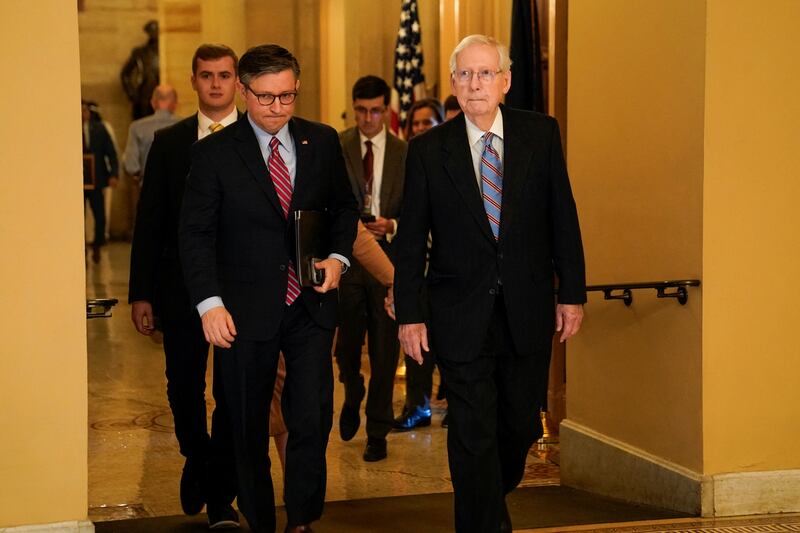 House Speaker Mike Johnson (R-LA) and Senate Minority Leader Mitch McConnell (R-KY) walk from McConnell's office to a lunch meeting