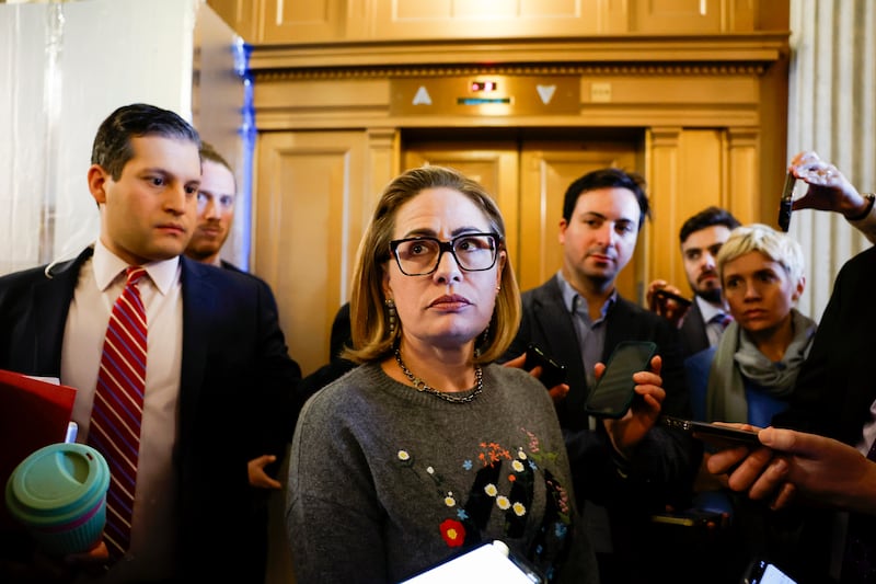 Sen Kyrsten Sinema (I-AZ) speaks to reporters during a vote in the Senate Chambers.