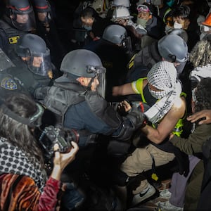 Demonstrators occupy a Pro-Palestinian encampment at UCLA as authorities breach and break up the encampment on Thursday, May 2, 2024 in Los Angeles, CA.