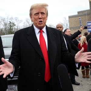 Former President  Donald Trump speaks as he makes a visit to a polling station on election day in the New Hampshire presidential primary