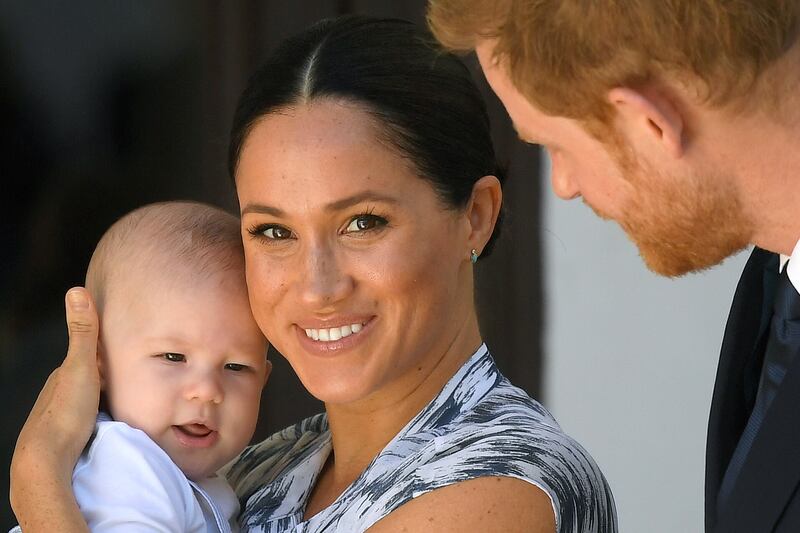 Prince Harry and Meghan Markle holding their son Archie, meet Archbishop Desmond Tutu (not pictured) at the Desmond & Leah Tutu Legacy Foundation in Cape Town, South Africa, September 25, 2019.