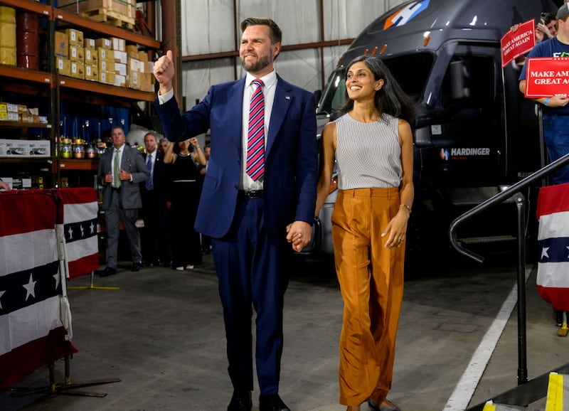 J.D. Vance (R-OH) walks on stage with his wife, Usha before speaking at a rally at a trucking company in Erie, Pennsylvania.