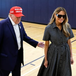 PALM BEACH, FLORIDA - NOVEMBER 05: Republican presidential nominee former President Donald Trump escorts his wife Melania Trump at the polling place in the Morton and Barbara Mandel Recreation Center on Election Day, on November 05, 2024 in Palm Beach, Florida.  Trump will hold an Election Night event at the Palm Beach Convention Center. (Photo by Chip Somodevilla/Getty Images)