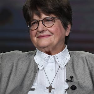 Sister Helen Prejean sitting on a stage.