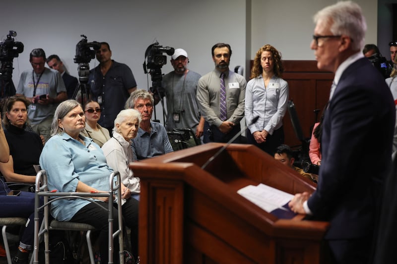 Members of the Menendez family listen as Los Angeles County District Attorney George Gascón speaks during a news conference at his office in Los Angeles on October 24, 2024.