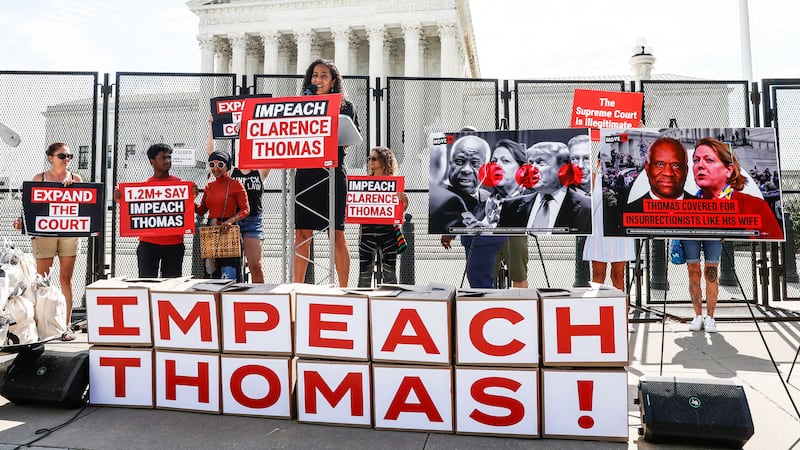 Executive Director of MoveOn.org Rahna Epting speaks at a demonstration 