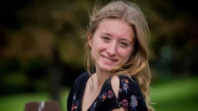 Kaylin Gillis smiles in an outdoor portrait.